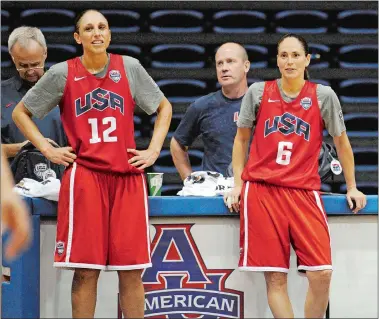  ?? NICK WASS/AP PHOTO ?? In this July 14, 2012, file photo, U.S women’s Olympic basketball players Diana Taurasi (12) and Sue Bird (6) watch during practice in Washington.