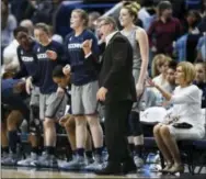  ?? JESSICA HILL — THE ASSOCIATED PRESS ?? Connecticu­t head coach Geno Auriemma, third from right, calls to his players during the second half of an NCAA college basketball game against Notre Dame, Sunday in Hartford, Conn.