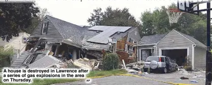  ?? AP ?? A house is destroyed in Lawrence after a series of gas explosions in the area on Thursday.