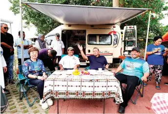  ?? — Bernama photo ?? Aminuddin (seated, second right) visits the campervan site at Pantai Batu 5, set up in conjunctio­n with the launch of the state’s Calendar of Events 2024.