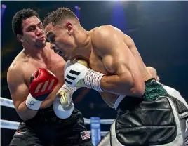  ?? GETTY IMAGES ?? David Nyika, right, sustained a hand injury during his knockout win against Louis Marsters in a cruiserwei­ght fight on the Gold Coast on Sunday.