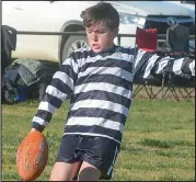  ??  ?? Cody Costello has a great kicking style in the under 12s.