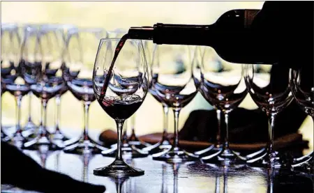  ?? JUSTIN SULLIVAN/GETTY ?? When you pour less wine into your glass, you can taste a greater variety of wines and have enough of that bottle to share with others.