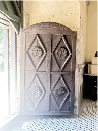  ??  ?? Heavy wooden doors at the church’s main entrance