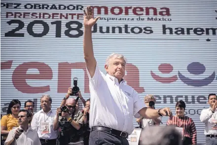  ?? ROBERTO E. ROSALES/JOURNAL ?? Mexican presidenti­al candidate Andrés Manuel López Obrador waves to the crowd after speaking during a campaign stop in Ciudad Juárez on Sunday. López Obrador said Mexico and its people will no longer be a piñata for foreign government­s.