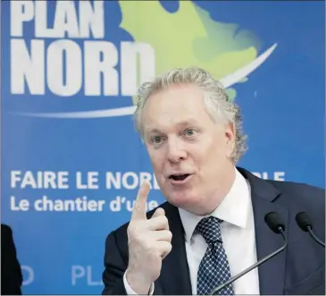  ?? JACQUES BOISSINOT CANADIAN PRESS ?? Premier Jean Charest announced an investment of $200 million in infrastruc­ture for northern Quebec on Tuesday.