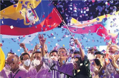 ?? PHOTO: GETTY IMAGES ?? Triumphant . . . Newly elected President of Ecuador Guillermo Lasso (centre) celebrates in Guayaquil after winning the presidenti­al runoff. Lasso has 52.51% of the votes and rival Andres Arauz 47.49%, with 97.27 of the votes counted.