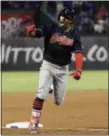  ?? TONY GUTIERREZ — THE ASSOCIATED PRESS ?? The Indians’ Francisco Lindor celebrates his grand slam as he rounds third during the ninth inning April 5 in Arlington, Texas.