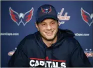  ?? ALEX BRANDON — THE ASSOCIATED PRESS ?? Washington Capitals’ John Carlson smiles during a media availabili­ty at their NHL hockey practice facility, Monday in Arlington, Va. The Washington Capitals have re-signed John Carlson to a $64 million, eight-year contract that allows the Stanley Cup...