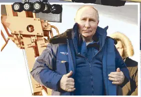  ?? AP ?? A Tu-160M strategic bomber with Russian President Vladimir Putin on board takes off from an airfield in Kazan, Russia on Thursday. Inset shows Putin getting off the warplane after the flight.