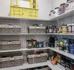  ?? William Luther / Staff photograph­er ?? The pantry in Barrera’s home kitchen is painstakin­gly organized.