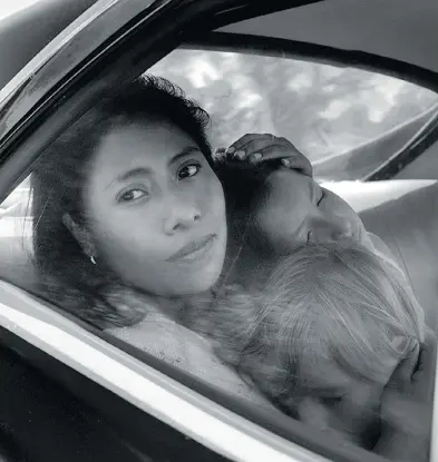  ?? NETFLIX ?? Marco Graf, Yalitza Aparicio, and Daniela Demesa in Alfonso Cuarón’s personal-yet-universal story Roma.