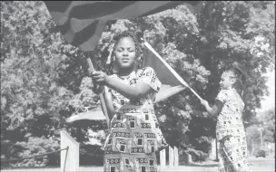  ?? REUTERS/Emily Elconin ?? People celebrate Juneteenth, which commemorat­es the end of slavery in Texas, two years after the 1863 Emancipati­on Proclamati­on freed slaves elsewhere in the United States, in Flint, Michigan, U.S., June 19, 2021.