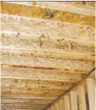  ??  ?? The load-carrying capacity of a floor is determined by the width and spacing of the kind of floor joists you see here. Reinforcem­ent of floors like this is often required for carrying non-standard loads.