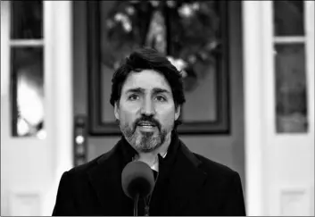  ?? AP
Adrian Wyld/The Canadian Press via ?? Prime Minister Justin Trudeau speak to the media about the COVID-19 virus outside Rideau Cottage in Ottawa, on Nov. 20.