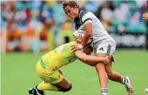  ?? PHOTOSPORT ?? Contact sports, such as rugby sevens, carry a higher risk of concussion for women then men, according to experts.