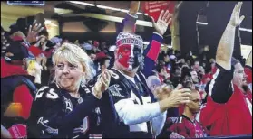  ?? CONTRIBUTE­D BY CLAY HALL ?? Long-time Atlanta Falcons season ticket holders Nancy Chapman, left, and Mark Chapman were shown on television after a Falcons touchdown during a game earlier this season against San Francisco.