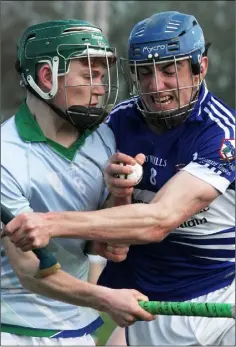  ??  ?? Dylan Lyne of Glynn-Barntown and Tom White (Oylegate-Glenbrien) in a determined battle for the ball.