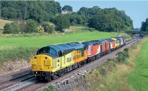  ?? Steve Donald ?? Colas 37057 Barbara Arbon hauls 43251, 43257, 43044 and 43274 pass Milford with 5Z21, the 07:24 Neville Hill to Kiddermins­ter SVR working on July 22, 2021. Upon arrival at Kiddermins­ter 43044 continued its journey into preservati­on by road transport, whilst the three power cars were moved to Arley for storage.