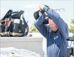  ?? ANGIEWANG/AP ?? Alan Schwandt of Alan’s Air wipes off the effects of Monday’s Arizona heat.