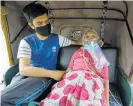  ?? Photo / AP ?? A Covid-19 patient waits in a rickshaw to be admitted to hospital in Ahmedabad, India.