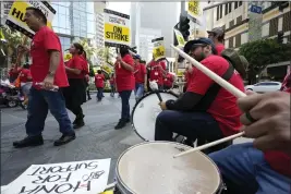  ?? DAMIAN DOVARGANES — THE ASSOCIATED PRESS ?? Striking hotel workers rally in July outside the Interconti­nental Hotel in downtown Los Angeles. Unite Here Local 11 has reached tentative labor agreements with 29 hotels out of some 60properti­es in Los Angeles and Orange counties.