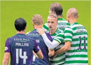  ??  ?? Leigh Griffiths with Hibs players after the full-time whistle.