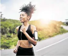  ?? PeopleImag­es / Getty Images ?? Researcher­s suggest that listening to motivation­al music while exercising can improve the level of enjoyment and performanc­e.