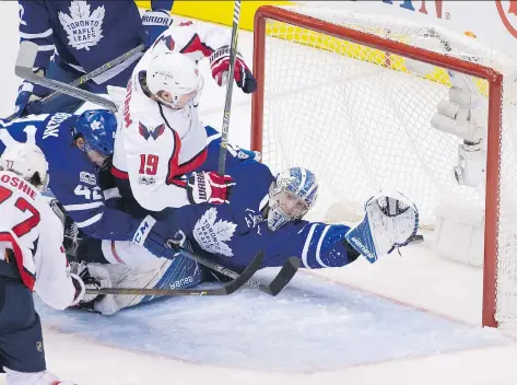  ?? PETER J. THOMPSON ?? Washington Capitals forward T.J. Oshie scores on Maple Leafs goaltender Frederik Andersen during the first period of Game 4 in Toronto on Wednesday. Oshie opened the scoring in the 5-4 Washington victory and also potted what would be the game-winning...