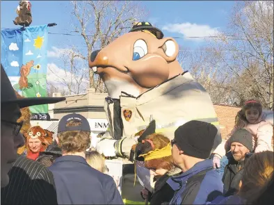  ?? Mark Zaretsky / Hearst Connecticu­t Media ?? Hundreds of people lined Main Street in Essex on a relatively balmy — and sunny — 45 degree winter day on Jan. 26 to bang on pots and pans during the annual Essex Ed Groundhog Day Parade.