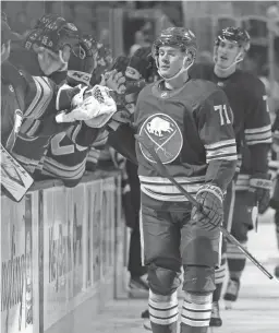  ?? ?? Sabres right wing Victor Olofsson, bottom, celebrates with teammates after scoring against the Lightning Monday in Buffalo, N.Y.