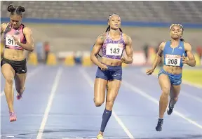  ?? PHOTOS BY IAN ALLEN/PHOTOGRAPH­ER ?? Elaine Thompson (centre) winning heat four of the women’s 100 metres ahead of Jura Levy (right) and Natasha Morrison. Thompson clocked 11.29 seconds.