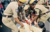  ?? — DC ?? Policewome­n try to arrest women Congress activists who were protesting after they were prevented from taking out a rally to Raj Bhavan.
