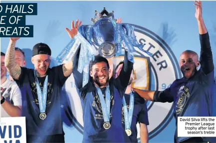  ??  ?? David Silva lifts the Premier League trophy after last season’s treble