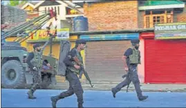  ?? ANI ?? Security personnel in action during the encounter in Sopore’s Warpora on Friday.