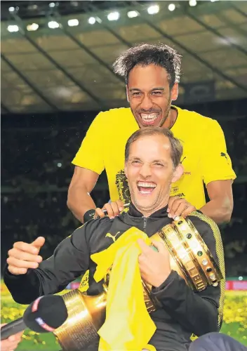  ?? FOTO: FIRO ?? Bald wiedervere­int? Thomas Tuchel und Pierre-Emerick Aubameyang nach dem Pokalsieg mit dem BVB 2017.