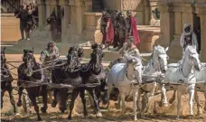  ?? PHILIPPE ANTONELLO ?? Messala (Toby Kebbell, left) and Judah (Jack Huston) go head to head on the coliseum track in a race to end all races.