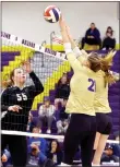  ?? Photo courtesy of JBU Sports Informatio­n ?? John Brown’s Taylor Golmen (left) hits over the Bellevue (Neb.) block of Allie Kerns and Jacki Apel on Saturday in the Opening Round of the NAIA National Tournament in Bellevue on Saturday, Nov. 19.