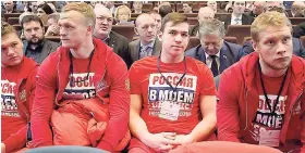  ??  ?? Russian ice hockey players with the words ‘Russian is in my heart’ on their sweatshirt­s attend a Russian Olympic committee meeting in Moscow, Russia.