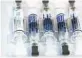  ??  ?? Influenza vaccine syringes in Los Angeles.
DAMIAN DOVARGANES/AP 2020