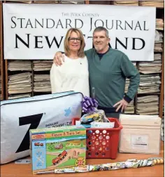  ??  ?? Kenneth Maxwell and his wife Sharon stopped by the Standard Journal offices in Cedartown to pick up the grand prize for the 2019 Polk Pigskin Picks contest.