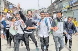  ?? HT FILE ?? Students take out a rally to protest against the recent killings by forces in Handwara; (right) a family member of Nayeem Qadir, who was killed in firing by security personnel on April 12.