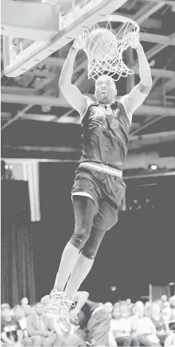  ?? AFP PHOTO ?? James White No. 8 of Trilogy dunks against Tri- State during week five of the BIG3 three on three basketball league at UIC Pavilion on Monday in Chicago, Illinois.