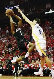  ?? AFP ?? Houston Rockets’ Chris Paul ( left) tries to go past Klay Thompson of the Golden State Warriors in Game Five of the Western Conference Finals of the NBA Playoffs at Toyota Center in Houston, Texas, on Thursday. —