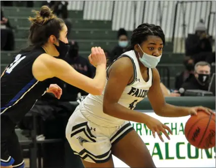  ?? PHOTOS BY DAN FENNER — FOR MEDIANEWS GROUP ?? Birmingham Groves’ Kaitlyn Quinn (right) dribbles around the defense of a Royal Oak defender in an Oakland Activities Associatio­n Red Division basketball game on Monday. Groves went on to win, 53-29.