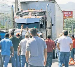  ??  ?? Help them here: Honduras truck drivers strike over high oil prices.