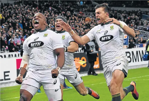  ?? Picture: ANNE-CHRISTINE POUJOULAT / AFP ?? NICK OF TIME: SA hooker Bongi Mbonambi, left, celebrates with winger Cheslin Kolbe, centre, and flyhalf Handre Pollard in the match against France at the Stade de France on Saturday