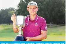  ??  ?? GOLD COAST: Cameron Smith of Australia celebrates with the Kirkwood Cup after winning the Australian PGA Championsh­ip at the Royal Pines golf course on the Gold Coast yesterday. — AFP