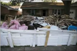  ?? MATT ROURKE — THE ASSOCIATED PRESS FILE ?? In this file photo, debris sits in front of a home in the aftermath of Hurricane Harvey in Houston.