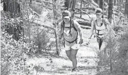  ?? COURTESY OF ARIZONA STATE UNIVERSITY ?? Michelle Loposky, left, of ASU’s Pat Tillman Veterans Center hikes alongside Sharon Lombard on Nov. 1.